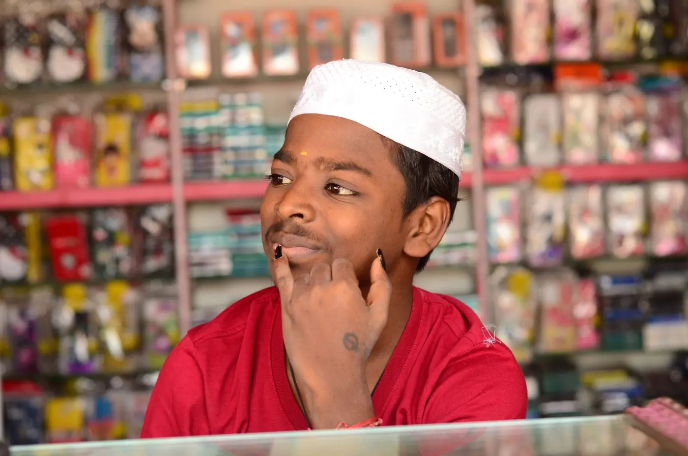 A shopkeeper at his counter