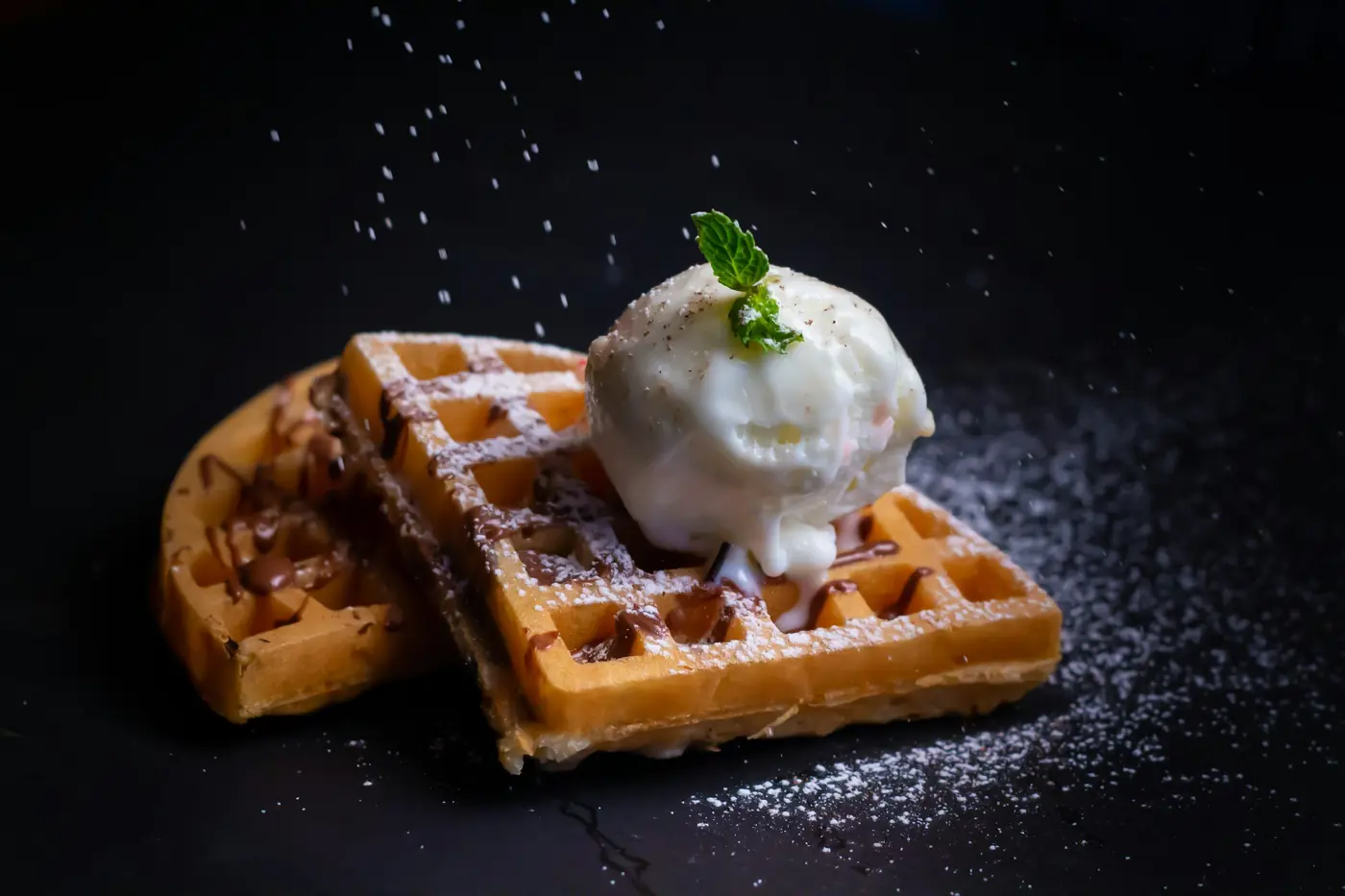 A waffle with a scoop of ice cream